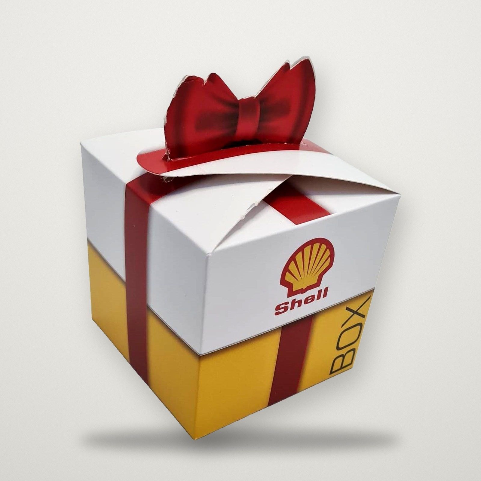 Caja de regalo troquelada con moño de cartulina impresa para Shell