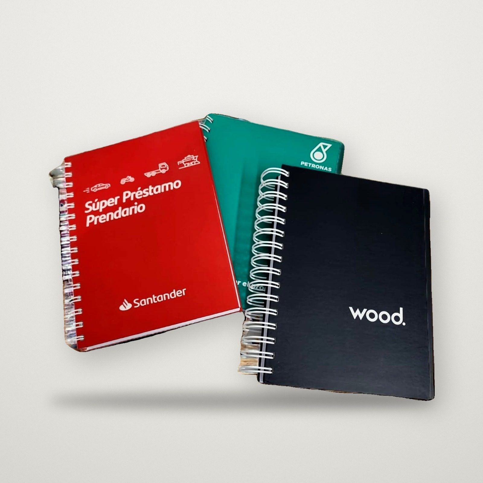 Cuadernos anillados de tapa dura personalizados para Santander, Petronas y Wood